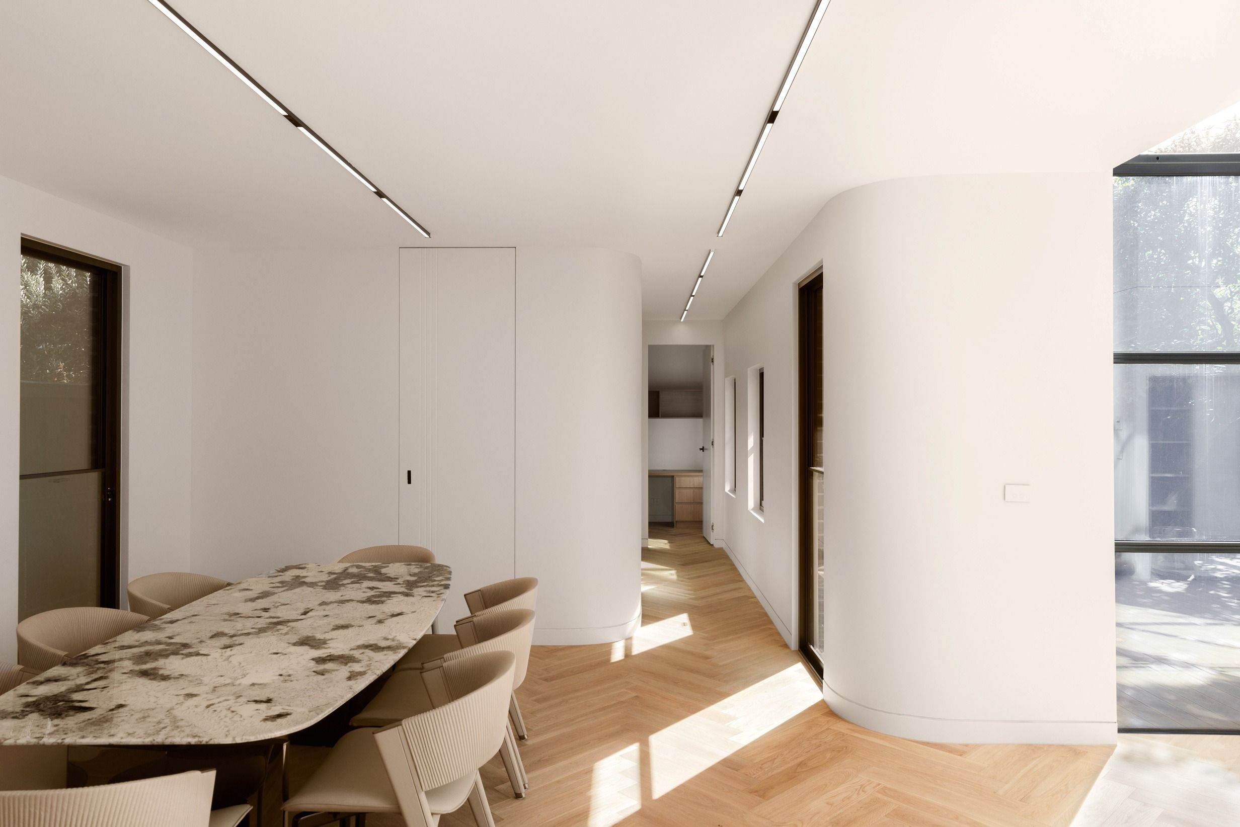 Natural Oak herringbone flooring beneath a dining setting in Kew.