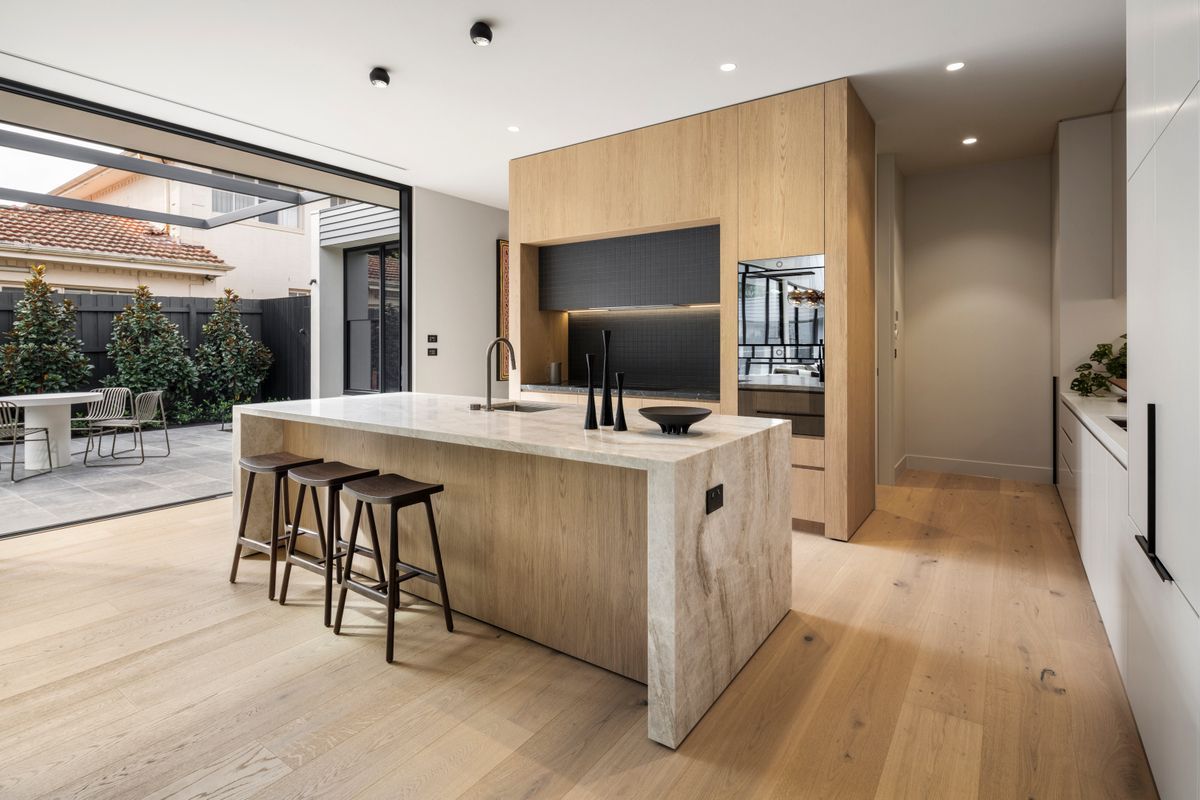 Straight-plank Avoca Bay oak flooring through a Kew kitchen and dining area.