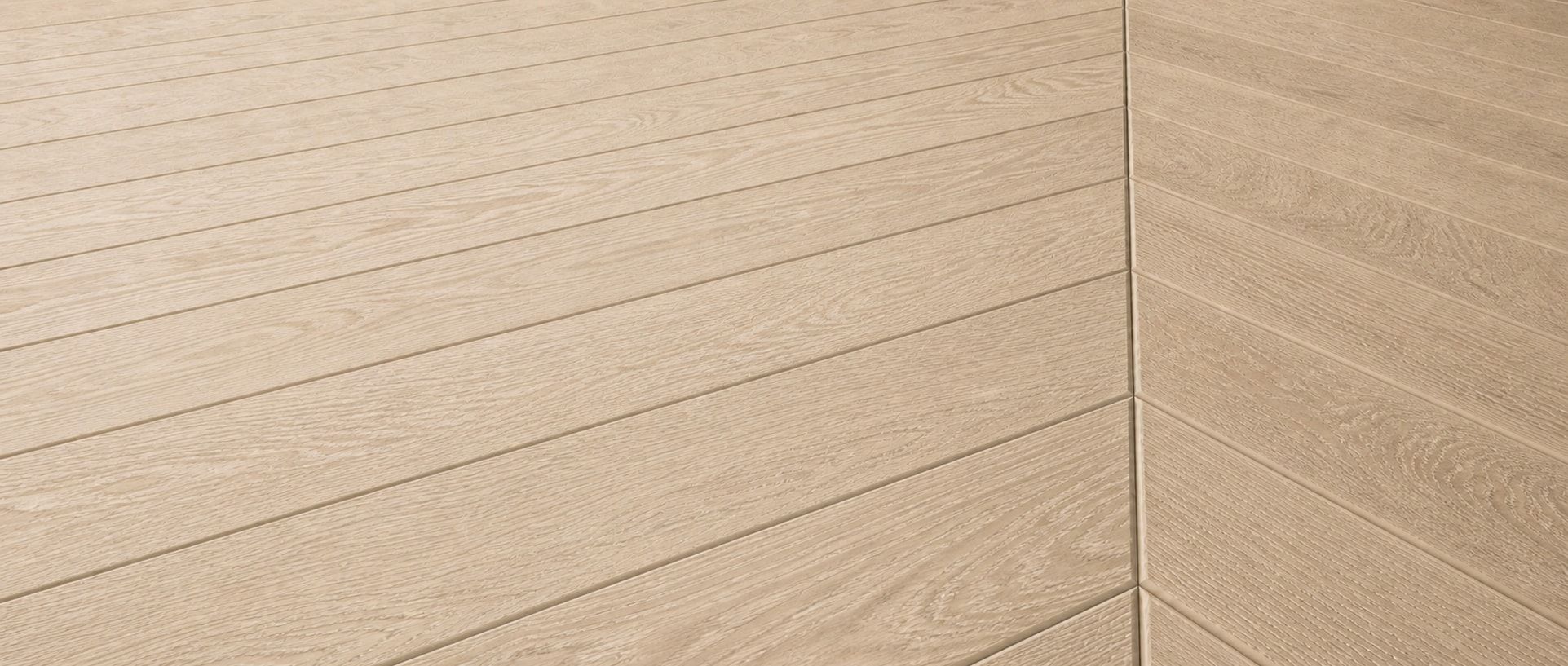 Pale French oak herringbone flooring photographed from an oblique left-facing angle