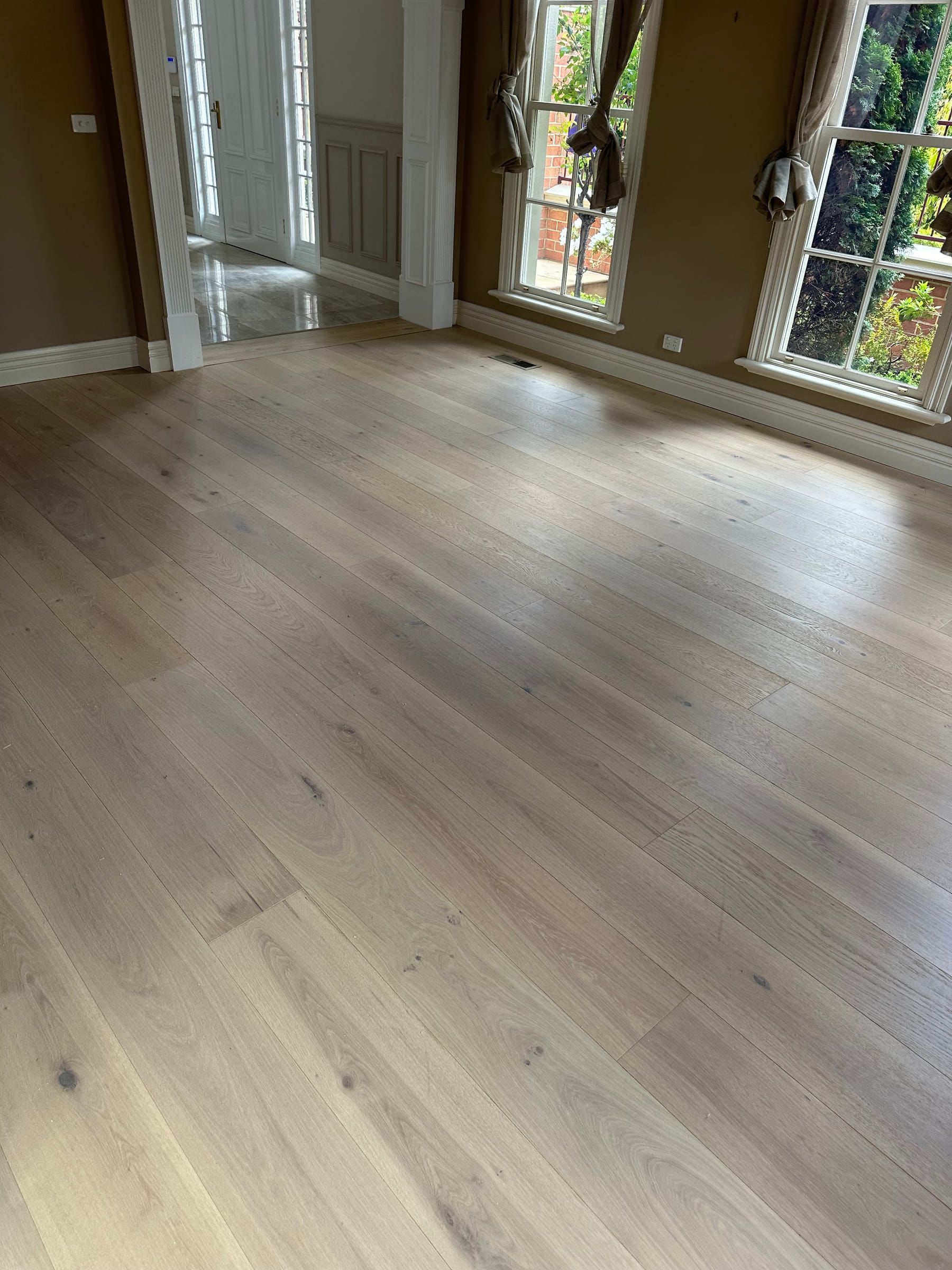 Natural-toned Tealight oak flooring in a bright Camberwell interior.