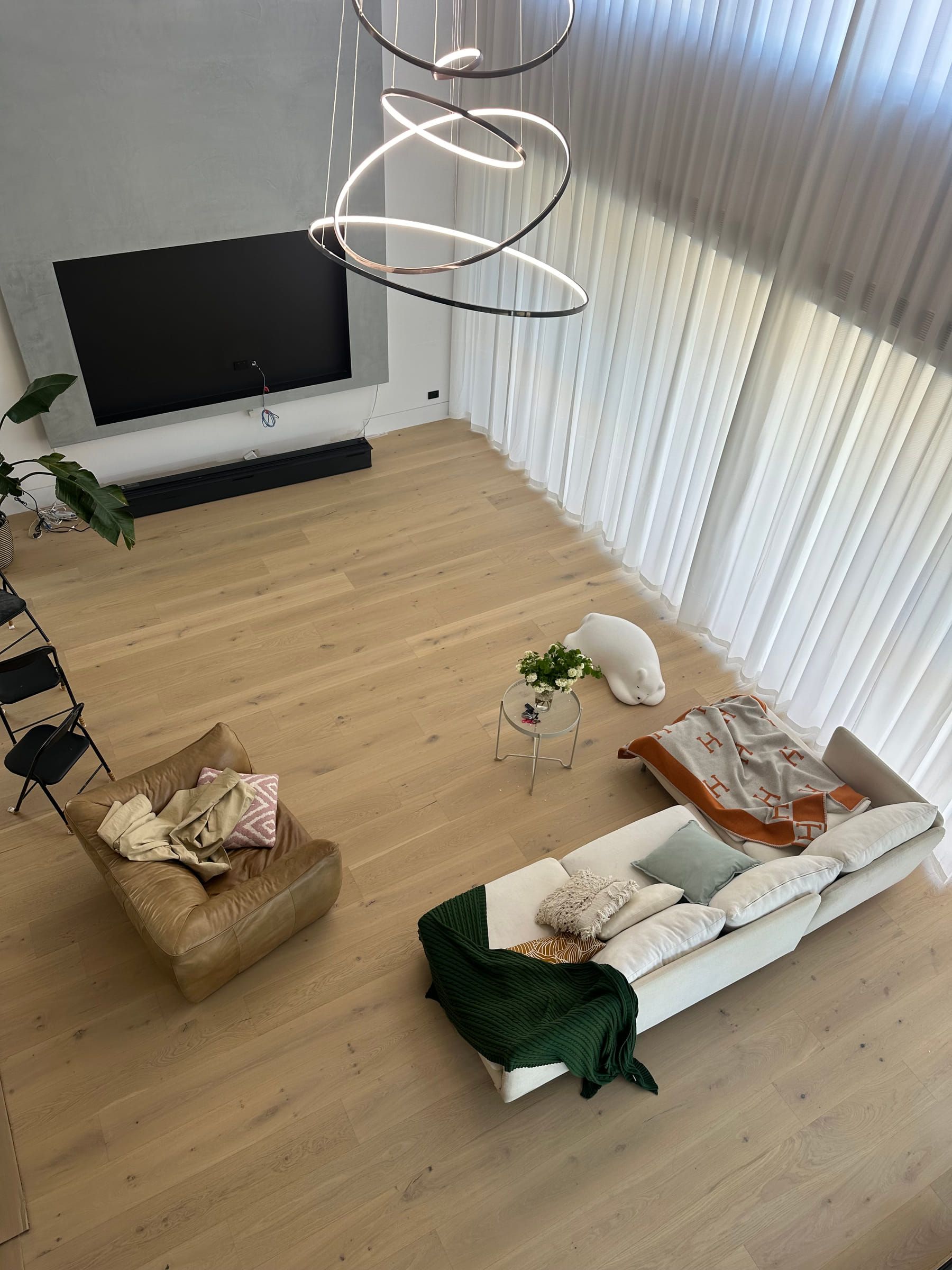 Avoca Bay engineered oak flooring across a double-height Camberwell living area.