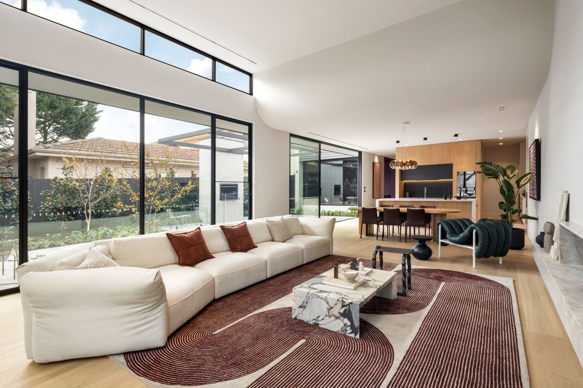 Wide view of Avoca Bay engineered oak flooring across a Kew open-plan interior.