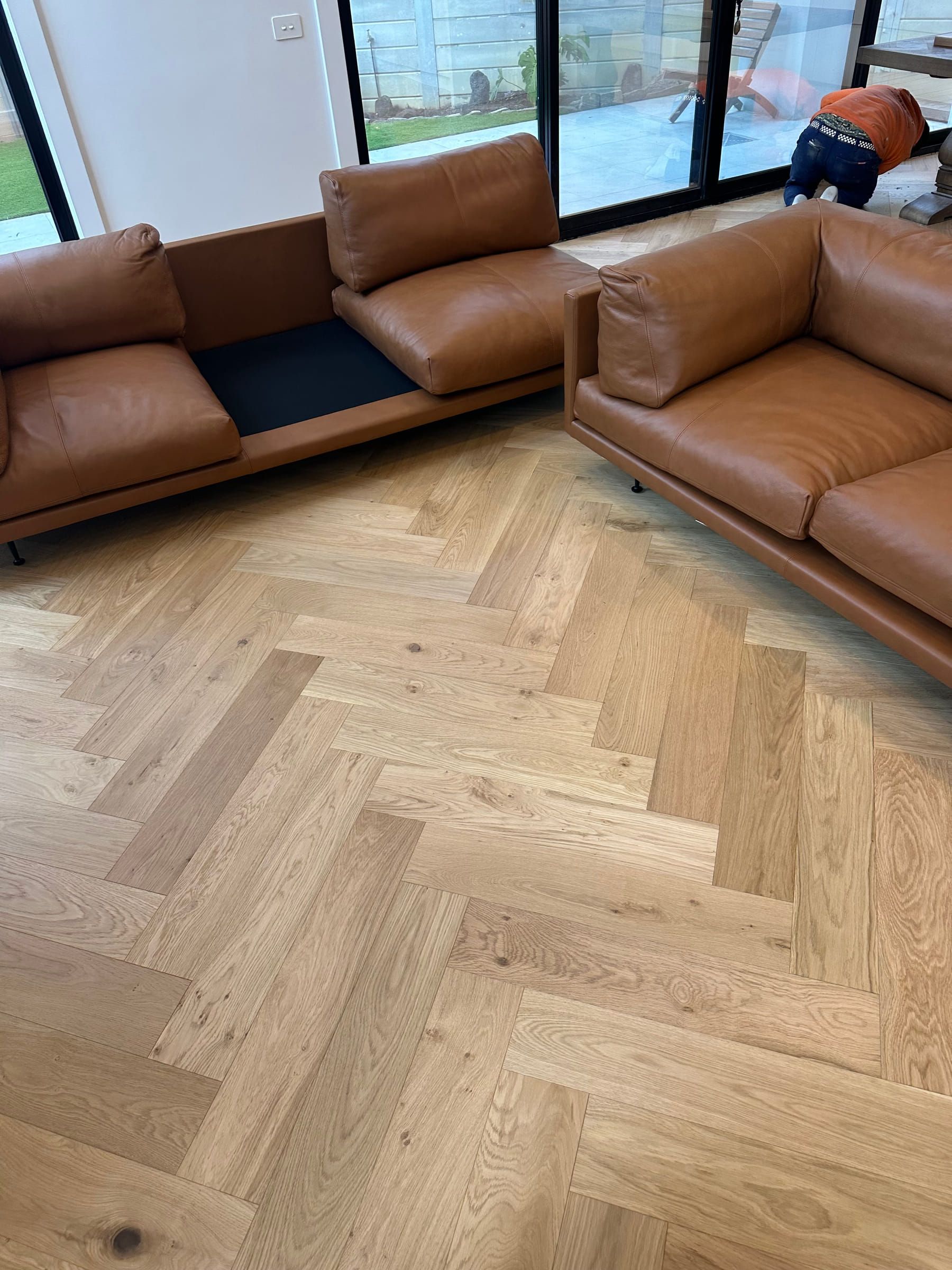 Engineered natural oak herringbone flooring in a Canterbury living area.