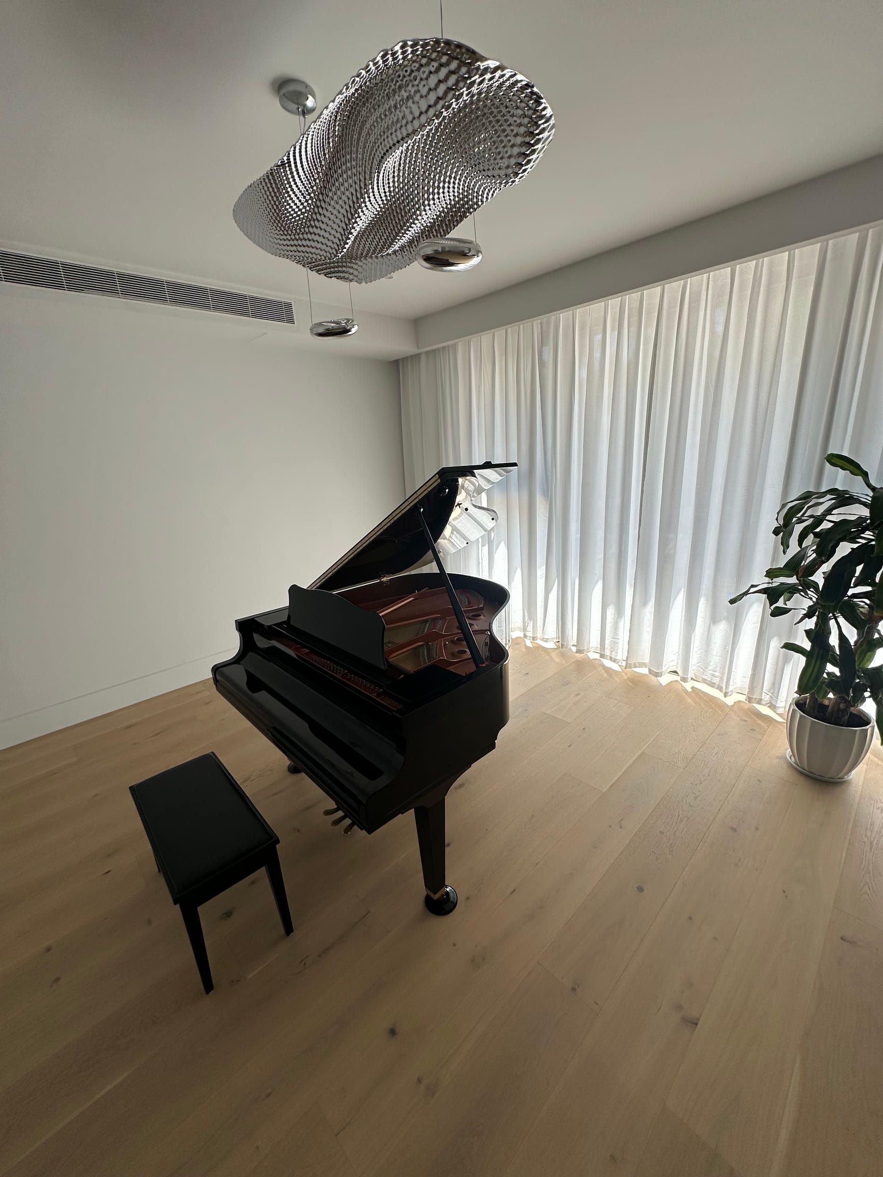 Engineered oak flooring in a Camberwell music area with a grand piano.