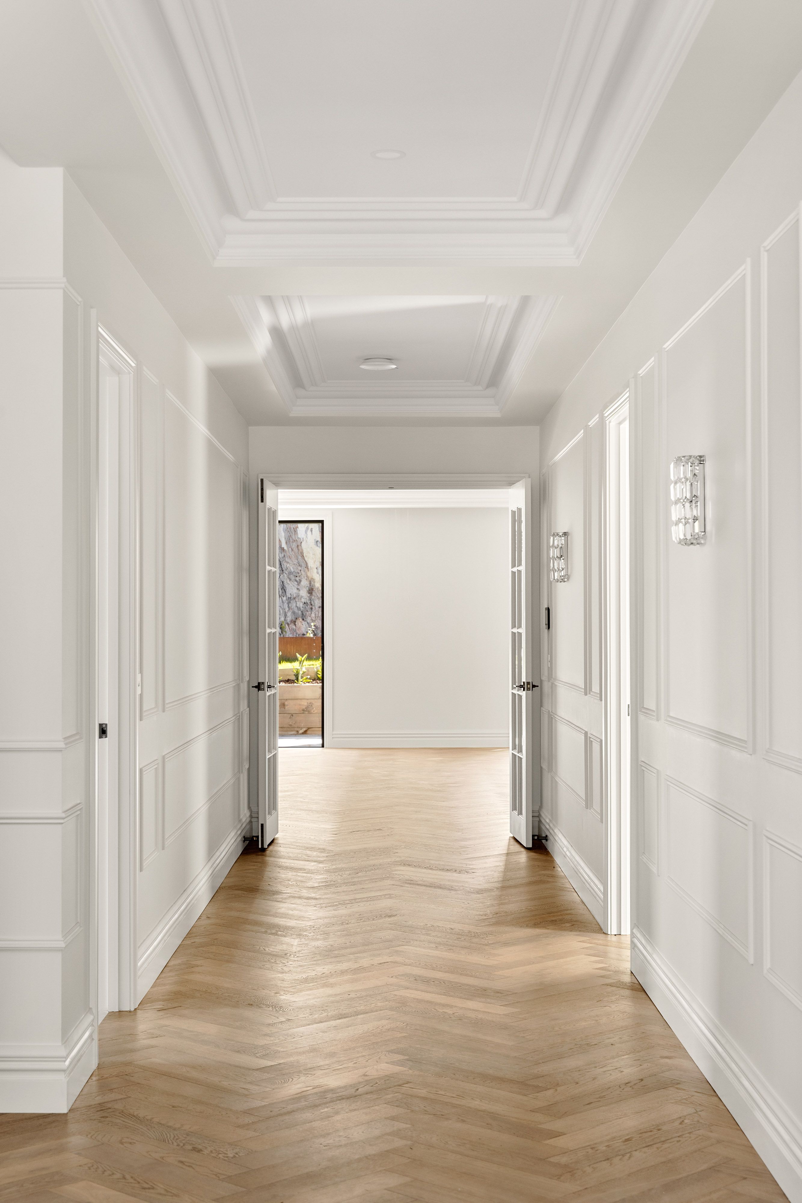 Smoked Brown herringbone flooring extending along a Balwyn hallway.