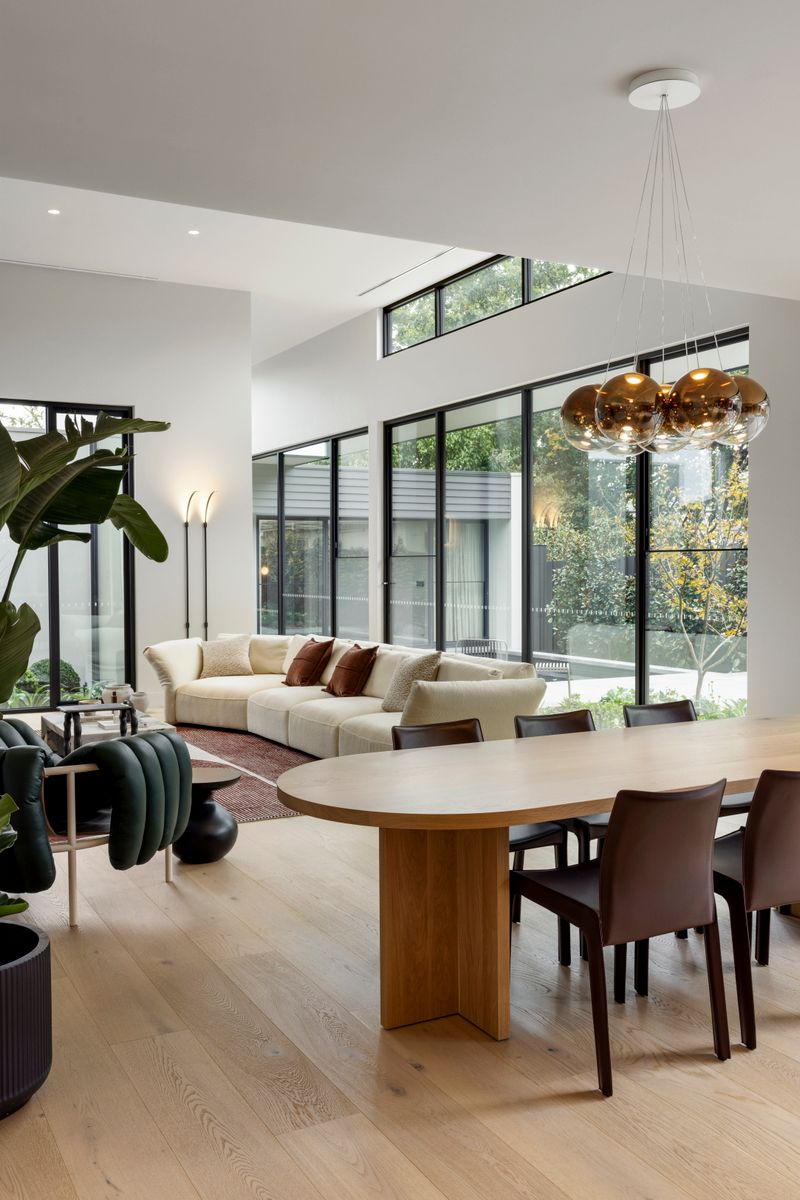 Avoca Bay oak flooring in a Kew dining area beside full-height windows.