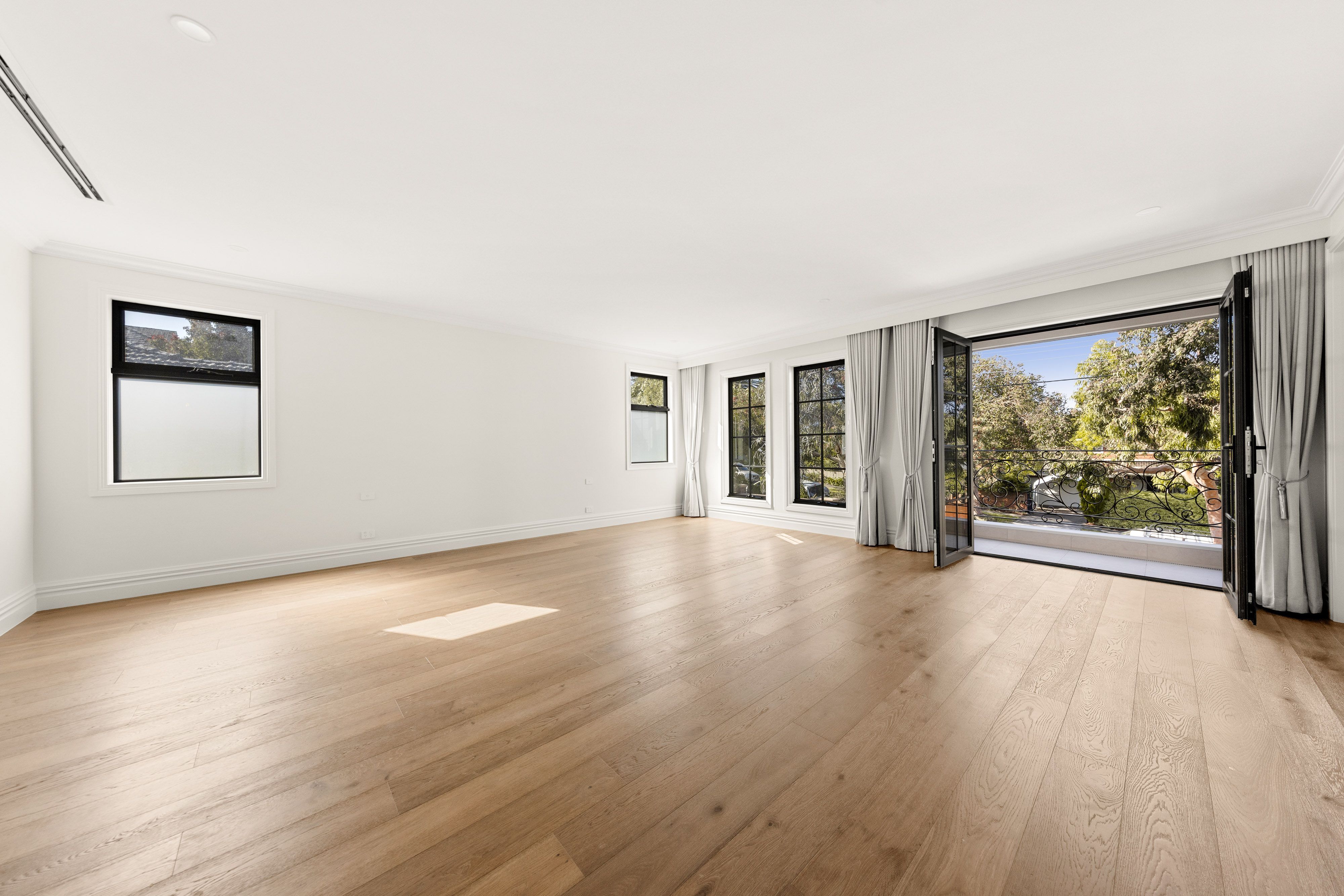 Smoked Brown straight-plank oak flooring in a large Balwyn living room.