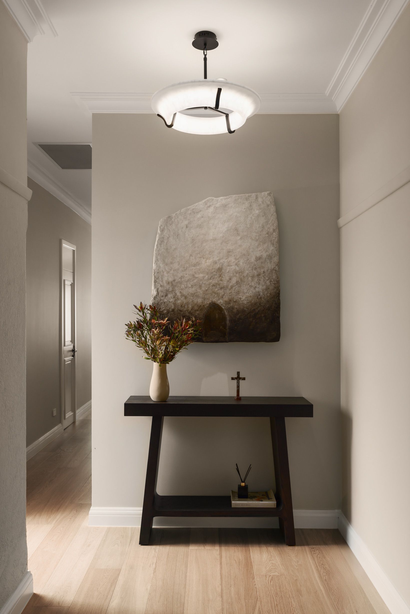 Chesterfield oak flooring along a decorated Canterbury hallway.