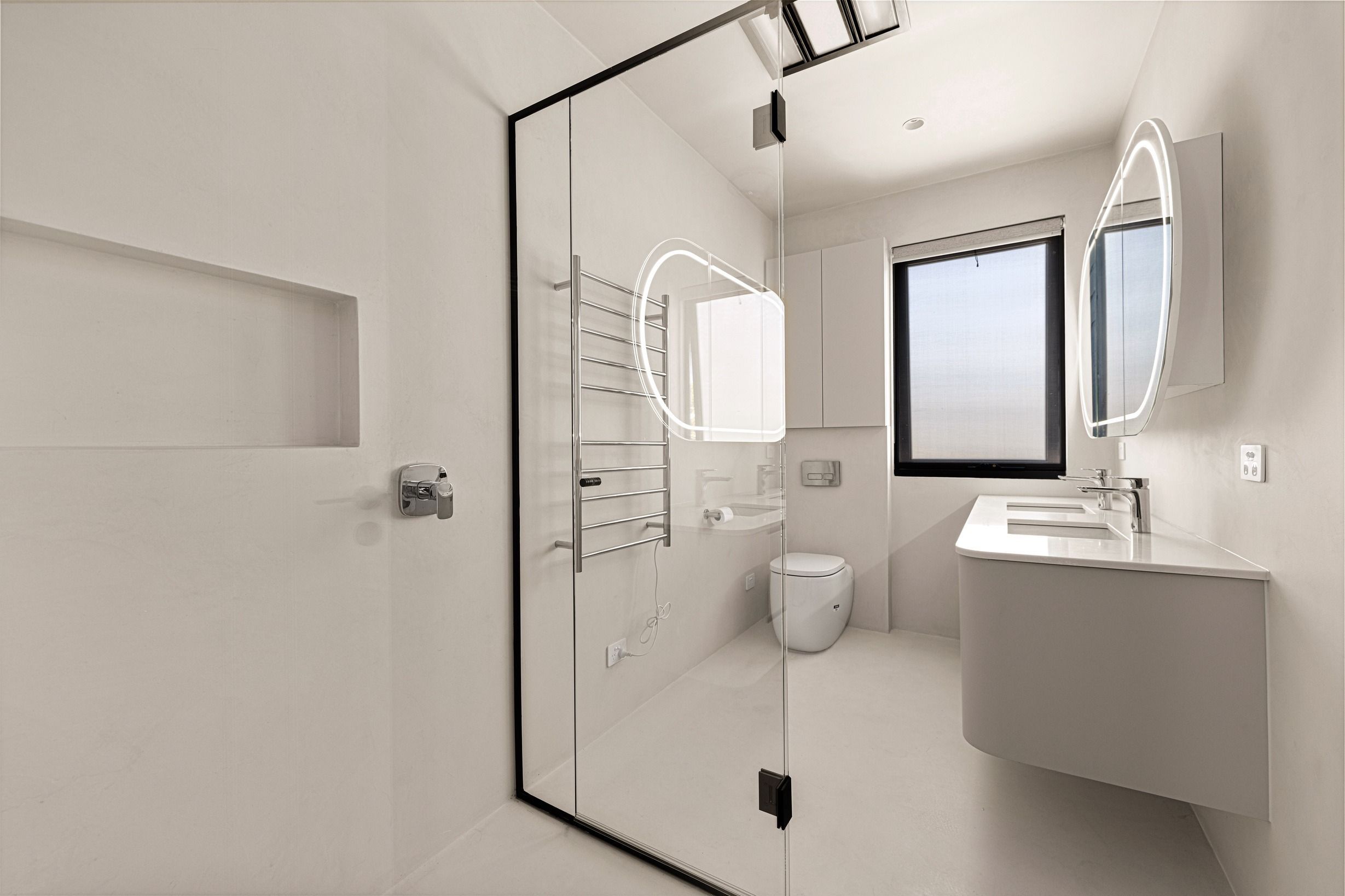 Black-framed shower enclosure in the completed Wheelers Hill bathroom.