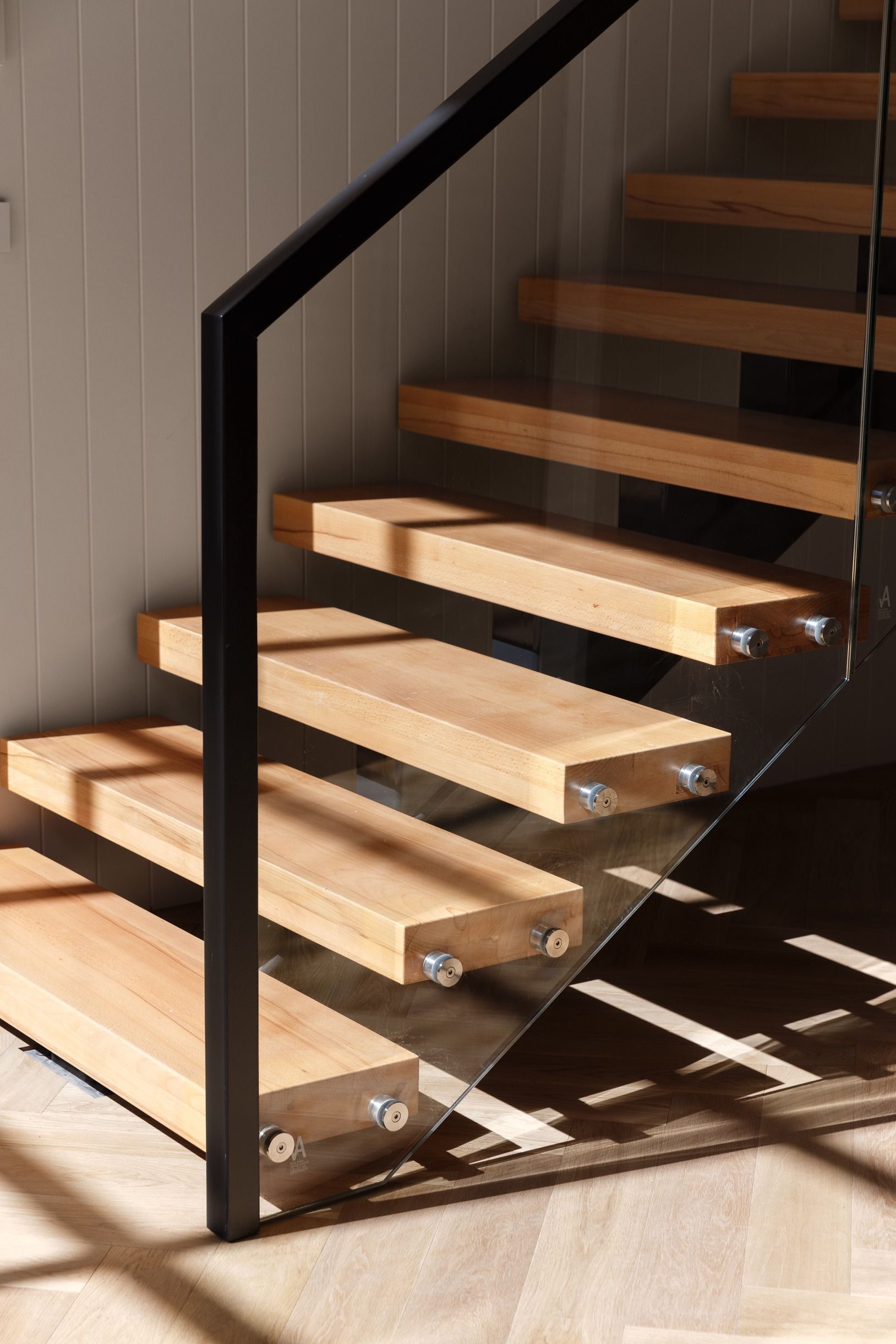 Open timber staircase coordinated with Natural Oak flooring in Kew.