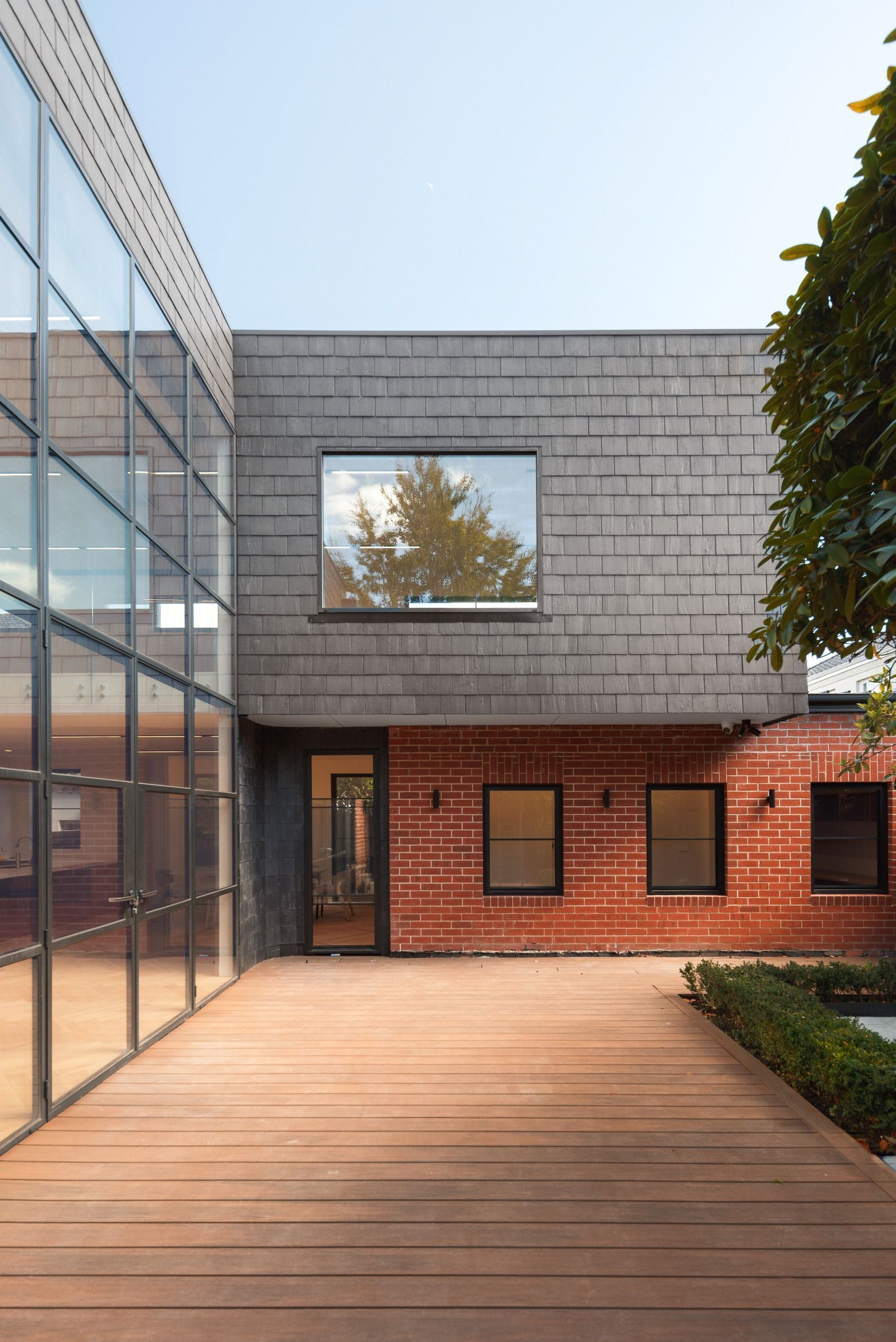 Rear courtyard and contemporary exterior of the completed Kew residence.