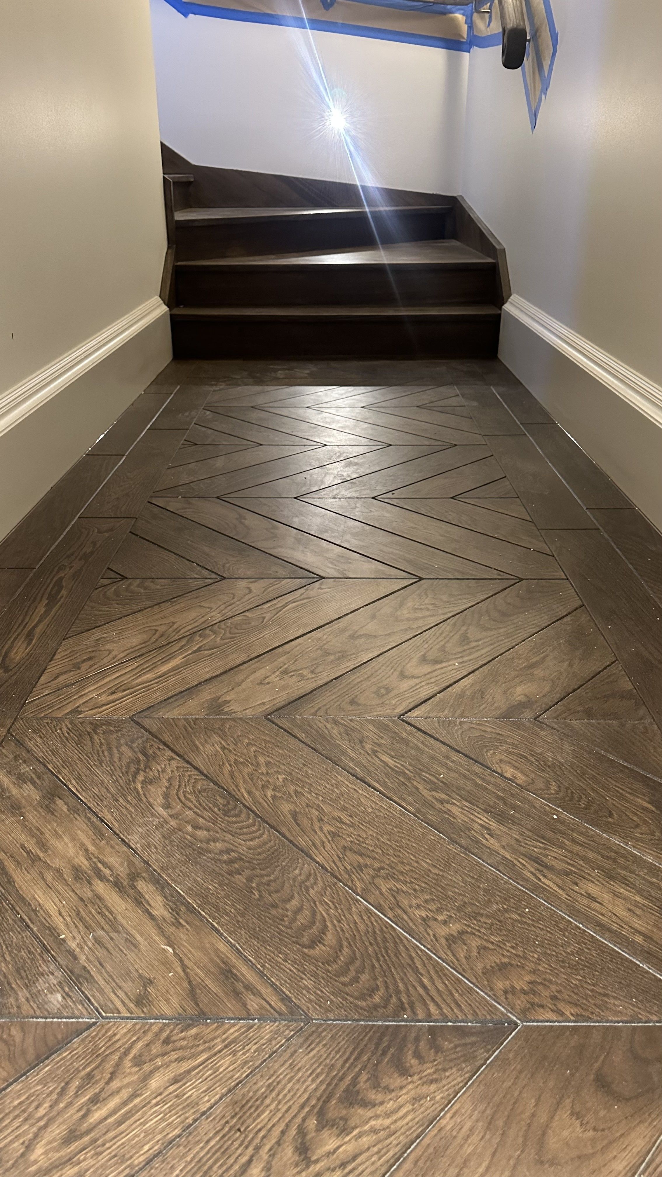 Solid oak chevron flooring in a small Balwyn North hallway.