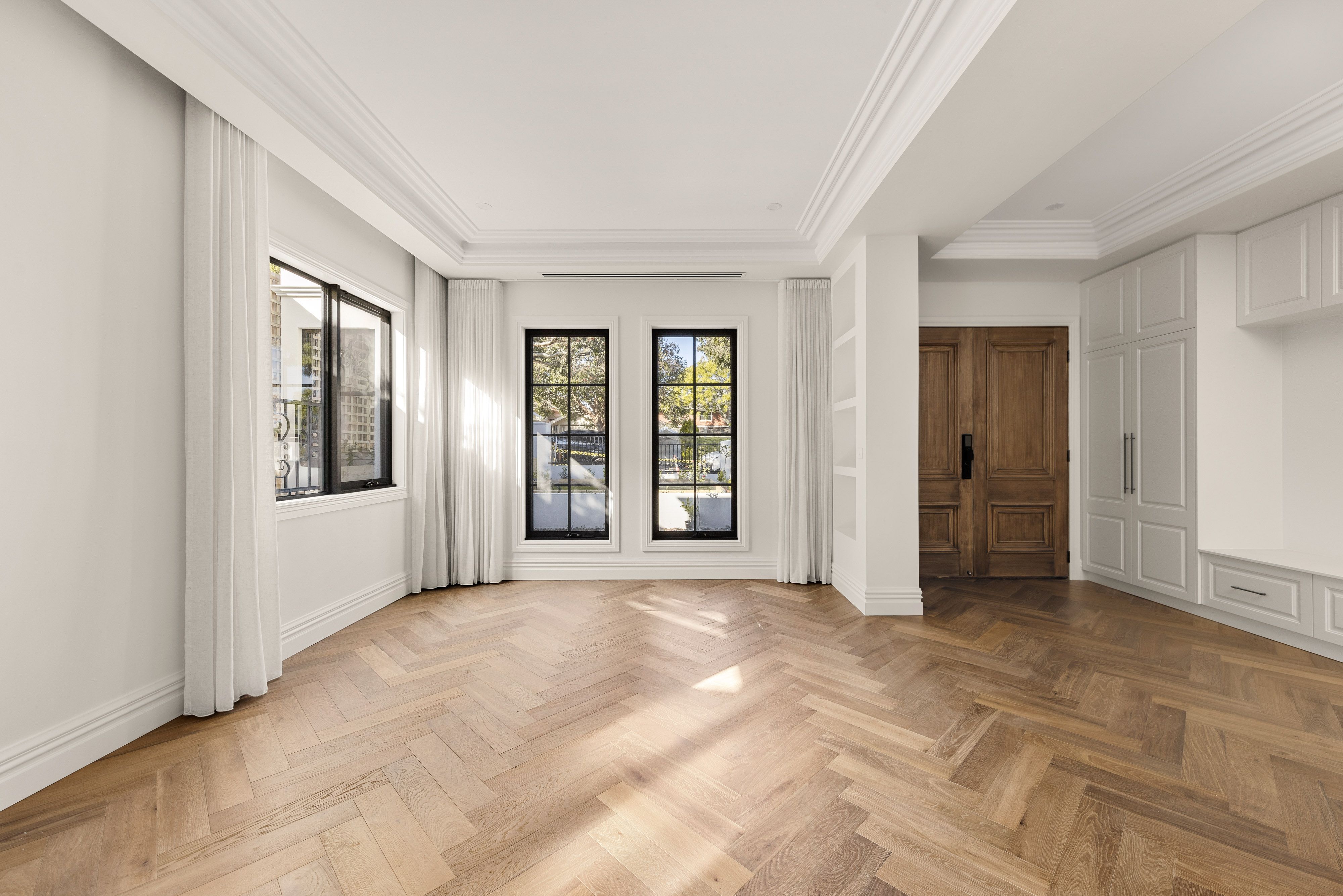 Smoked Brown herringbone flooring across a formal Balwyn living room.