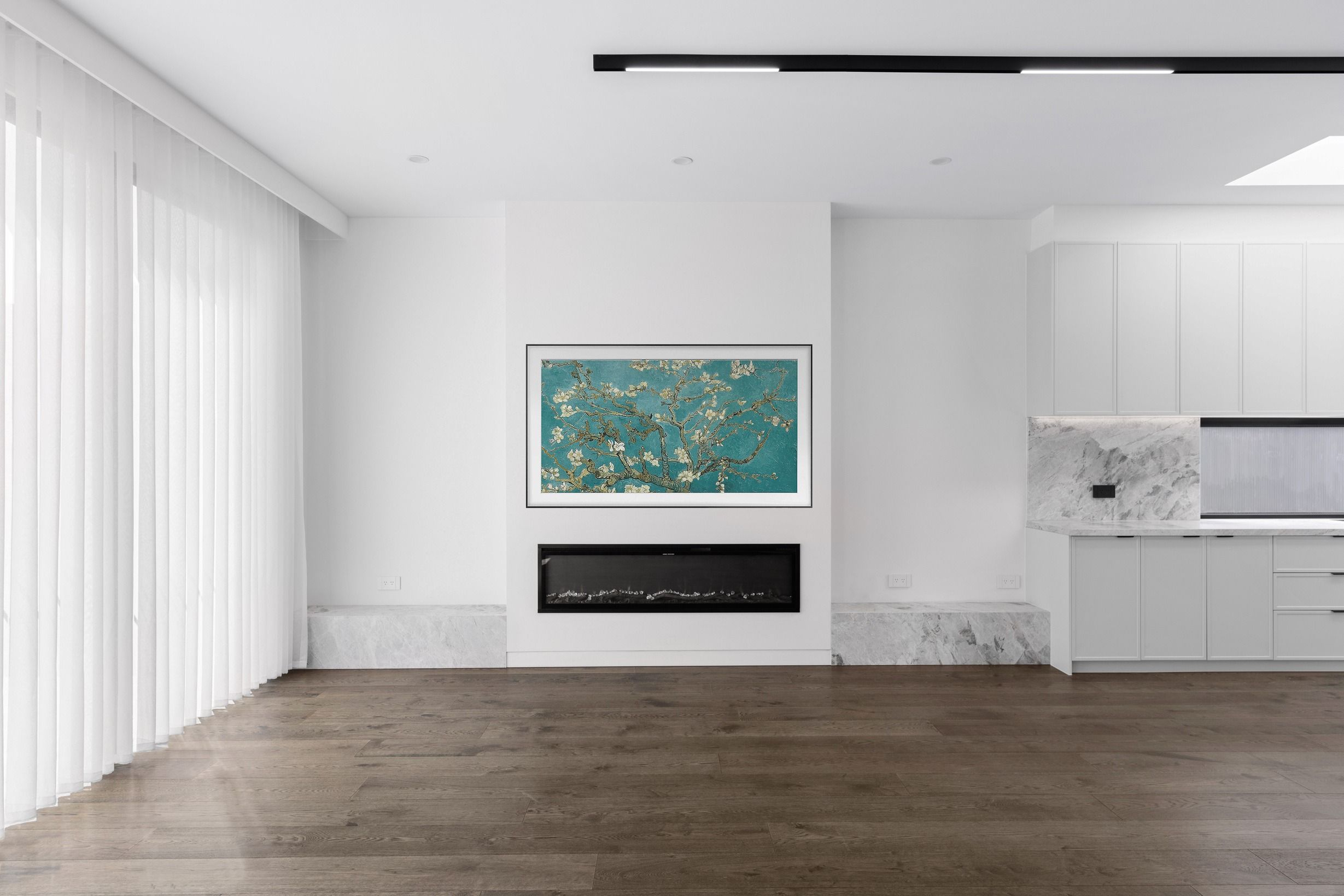 French Grey engineered oak flooring in a Glen Iris living room with fireplace.