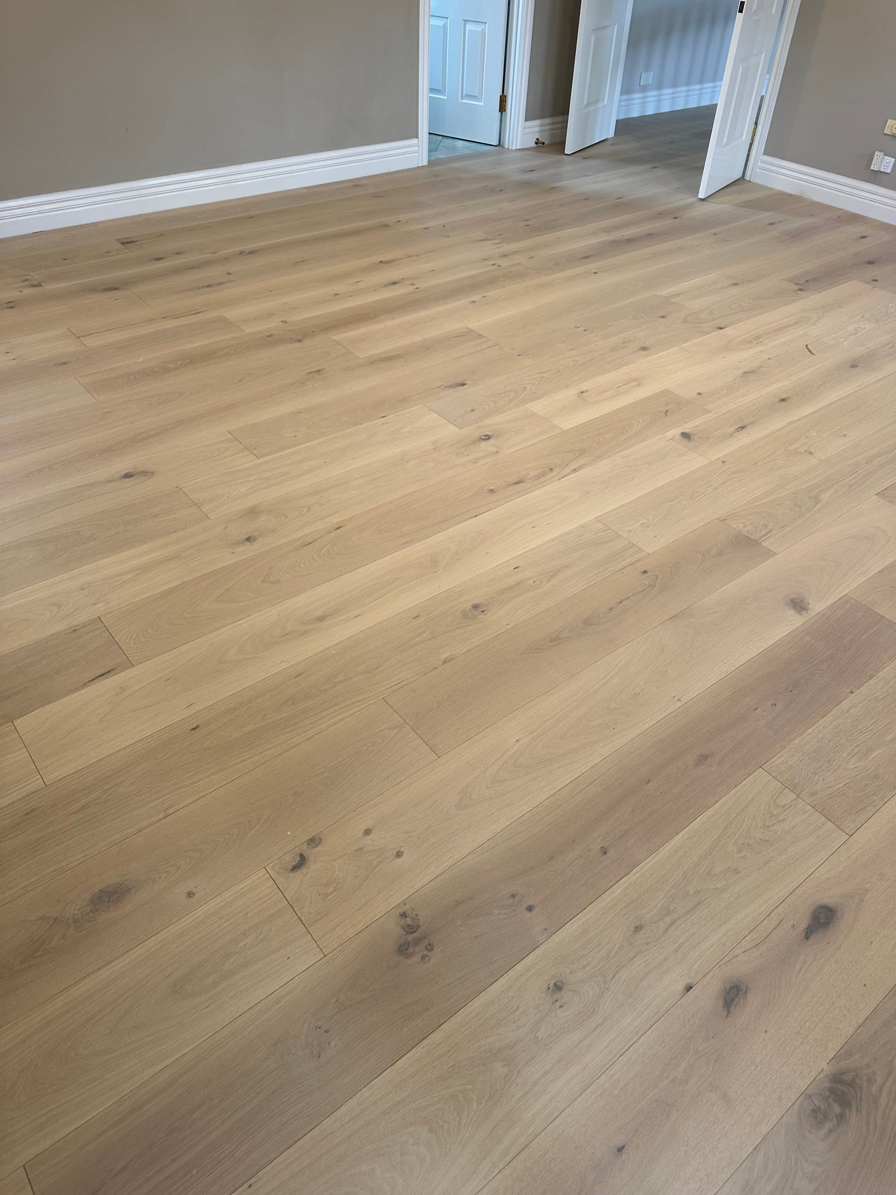 Close view of Tealight engineered oak planks installed in a Camberwell room.
