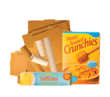 A pile of cardboard, cardboard tubes, a cereal box, and a cracker box.
