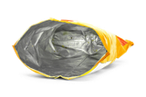 Empty, crumpled orange and yellow chip bag showing its silver interior with a few crumbs.