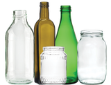 Assortment of empty glass bottles and jars, including clear, brown, and green.