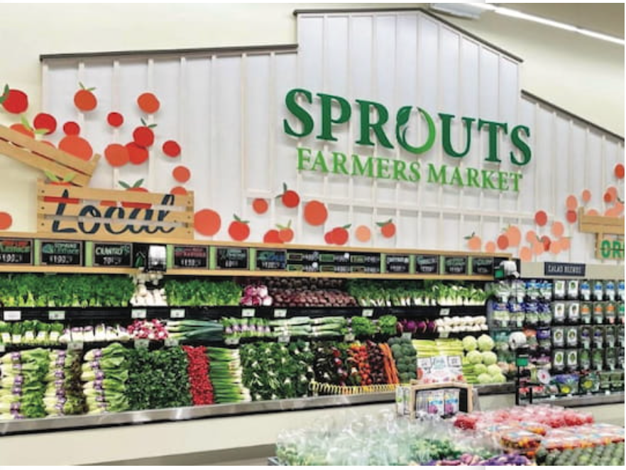 Sprouts Farmers Market produce section displaying a wide variety of fresh vegetables and greens.