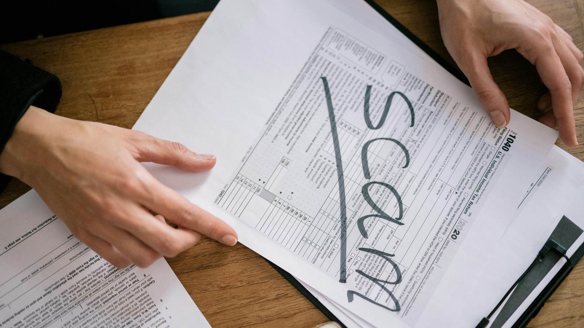 Document with Scam written on it