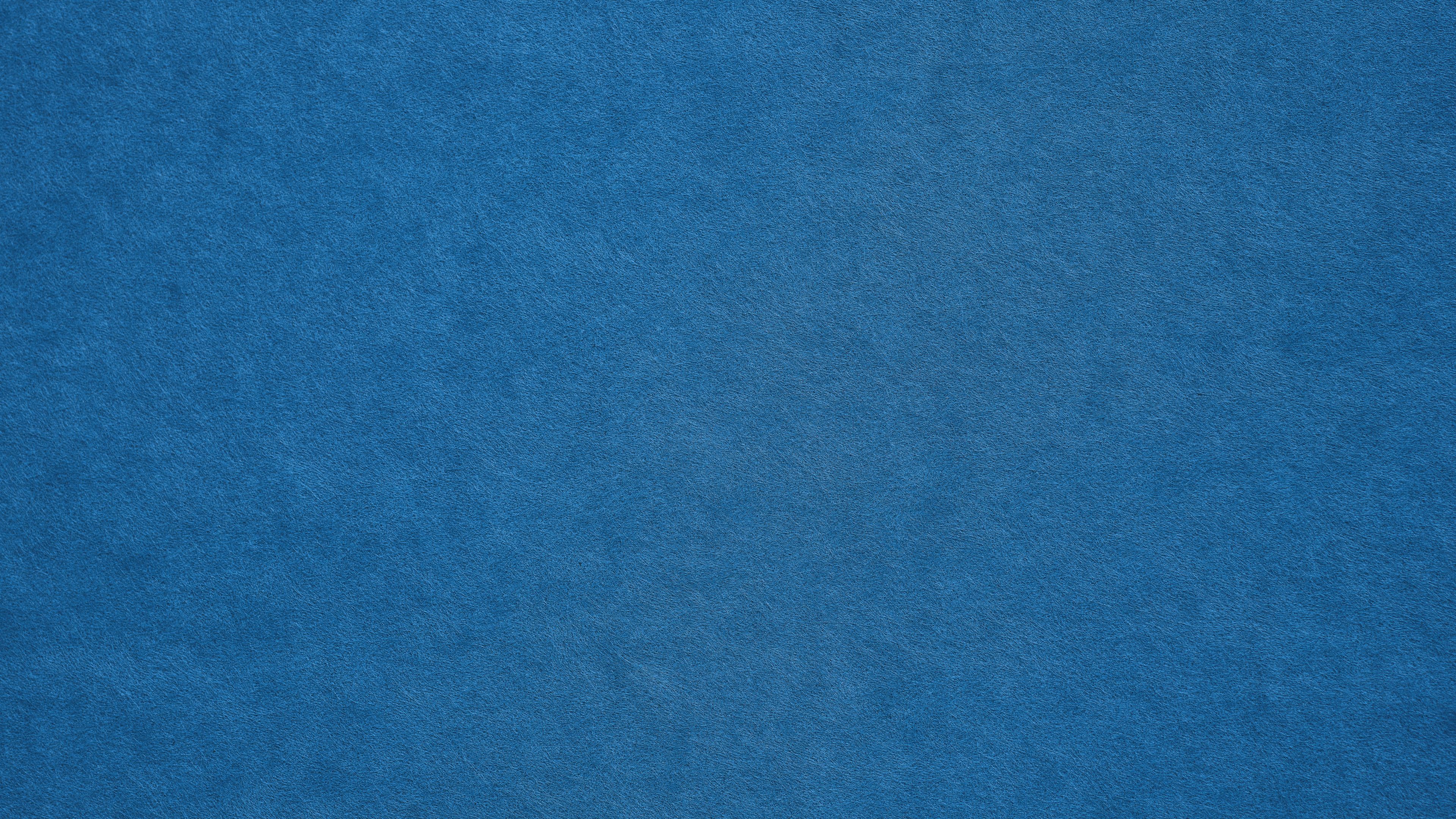 a close up of a blue paper texture .