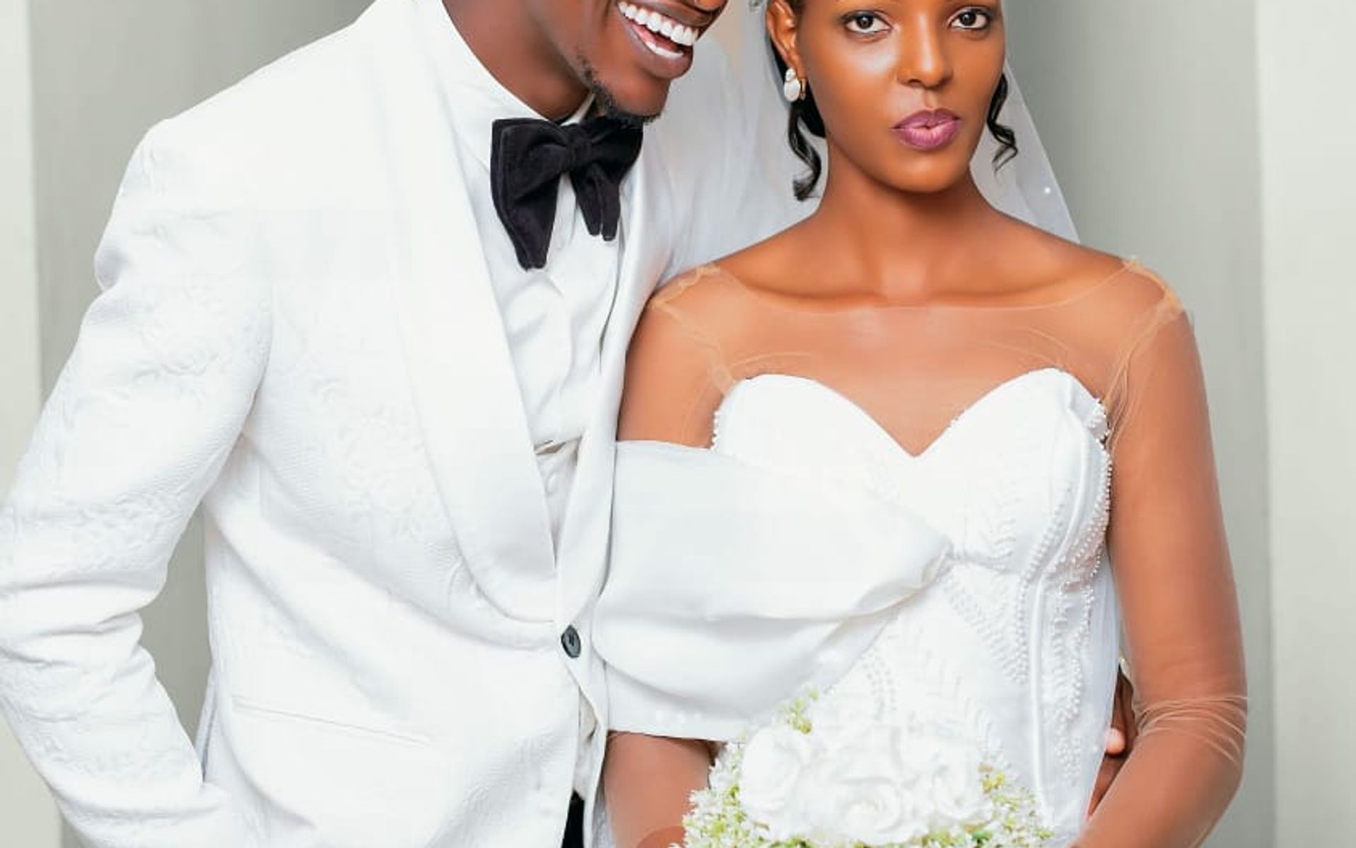 Bride and groom sharing a candid moment in a hallway, wedding day