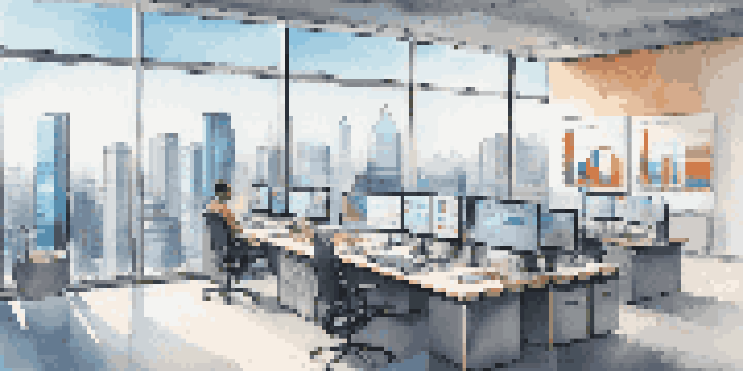 A contemporary real estate office featuring advanced technology and data analytics on display, with an urban view outside.