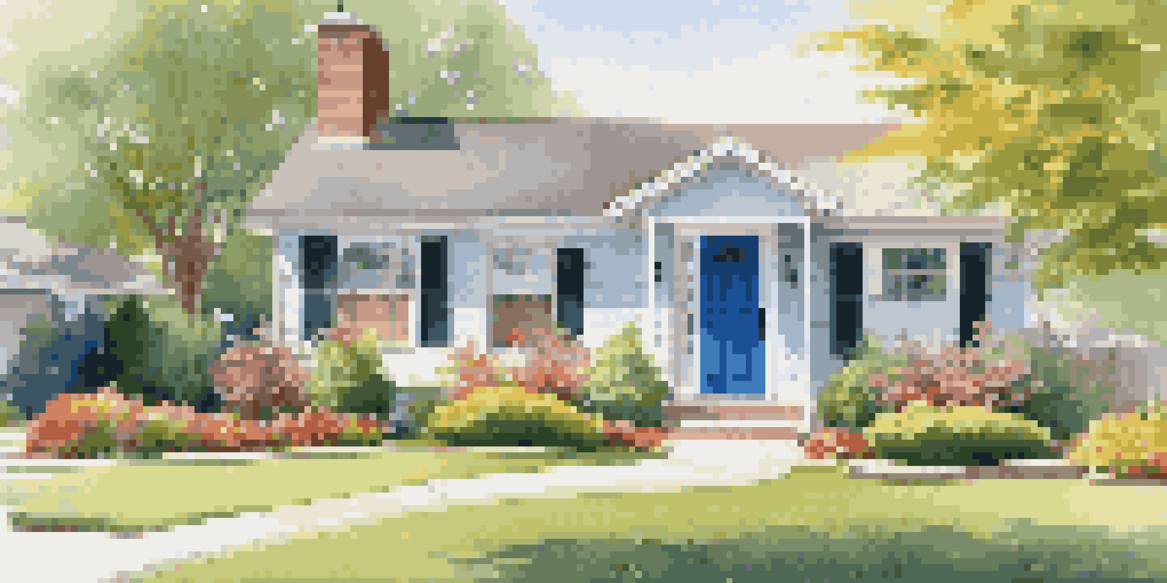 A sunny suburban front yard with a well-kept lawn, vibrant flowers, and a freshly painted door.