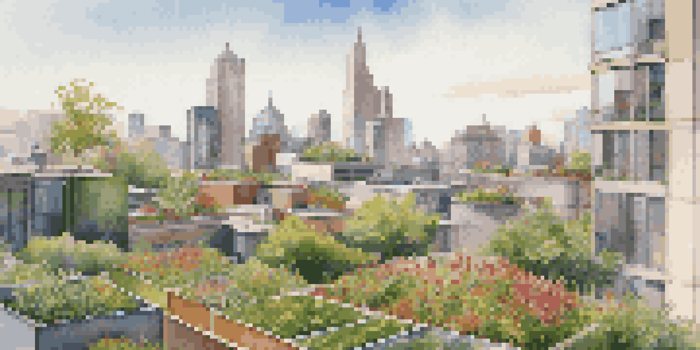 A city skyline with buildings that have green roofs filled with vegetation, under warm sunlight.