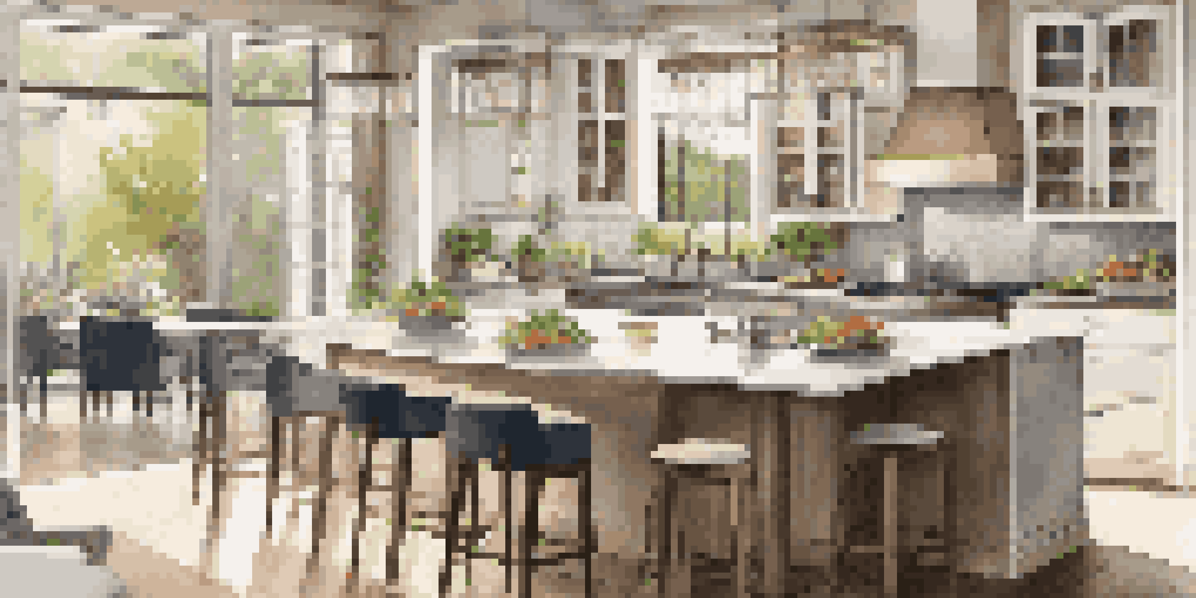 A modern kitchen with natural light, showcasing sleek countertops and contemporary appliances.