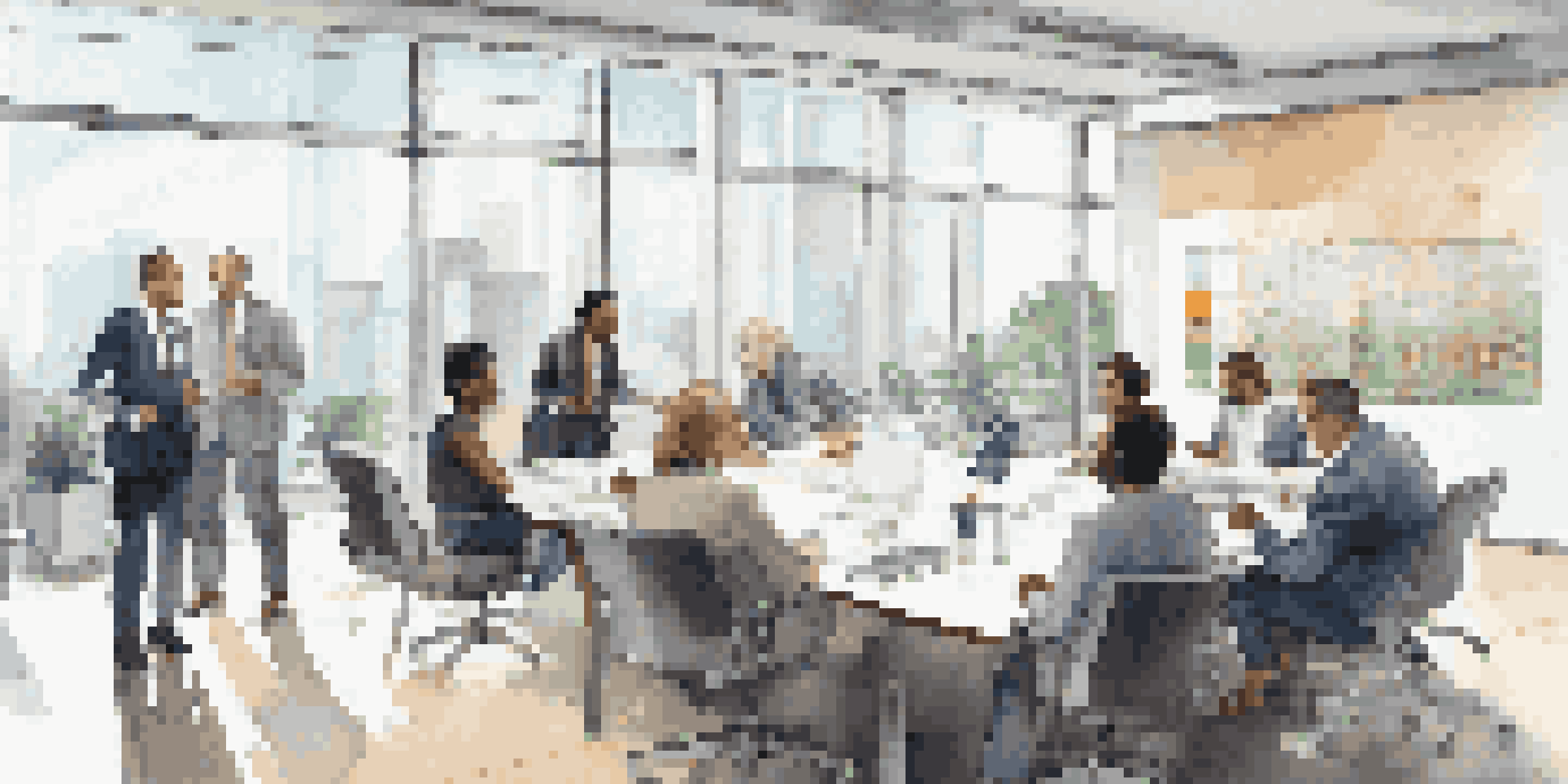 A bright modern office with diverse investors discussing real estate strategies around a large conference table, with a screen showing property statistics.