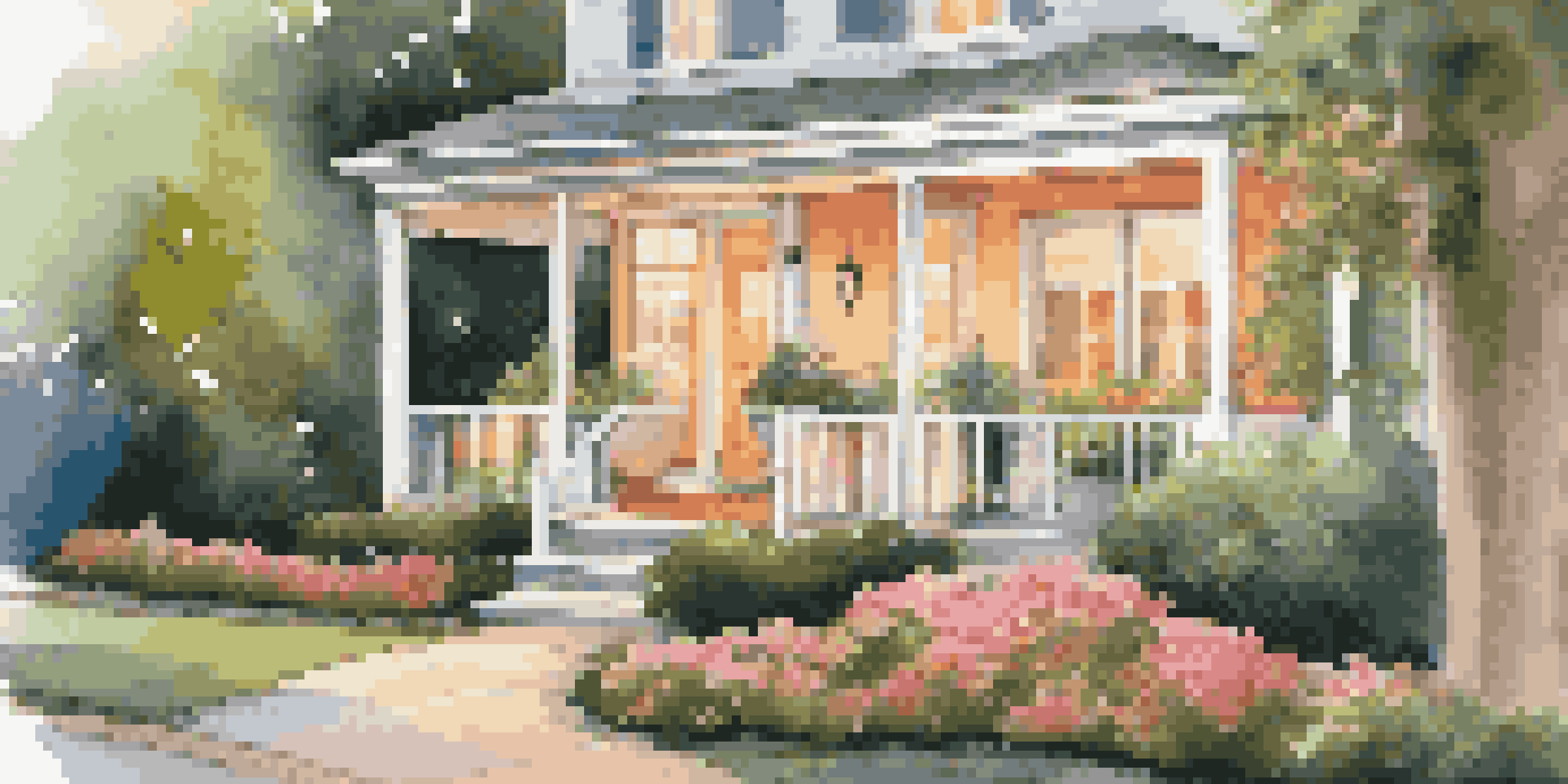 A beautiful rental property with vibrant flowers, clean walkways, and soft lighting, showcasing excellent curb appeal.