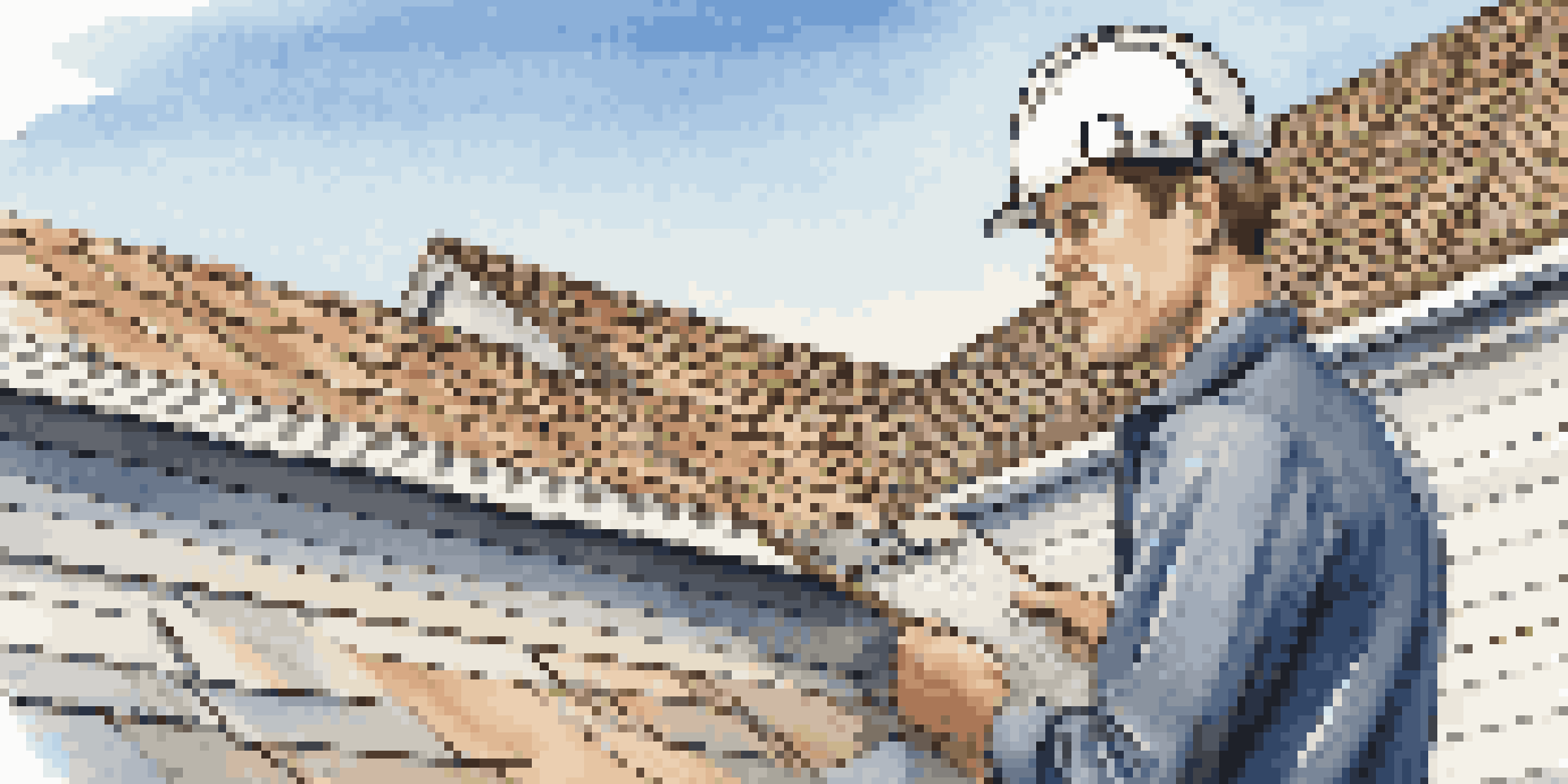 A home inspector closely examining a roof with a clipboard in hand, under a clear blue sky.