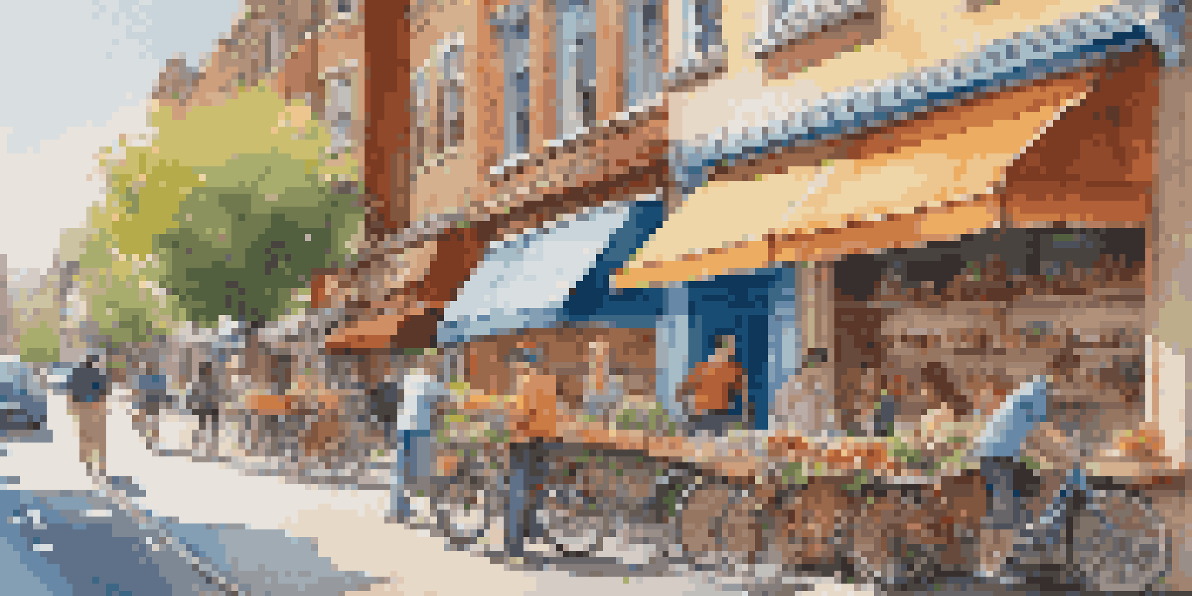 A busy urban street filled with people and colorful shops, with a bright blue sky and warm sunlight.