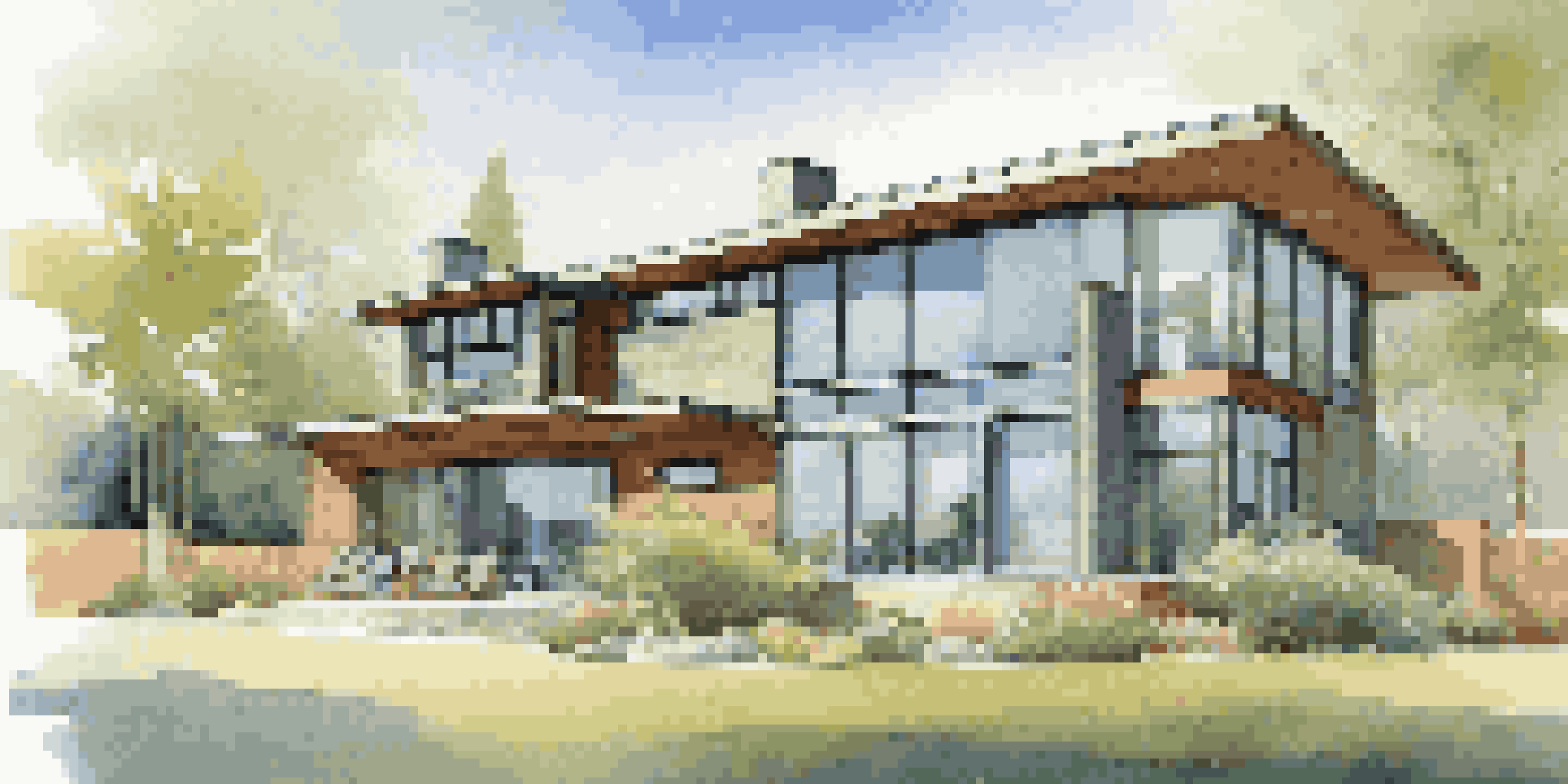 A contemporary house with big windows, surrounded by green plants and trees, under a bright blue sky.