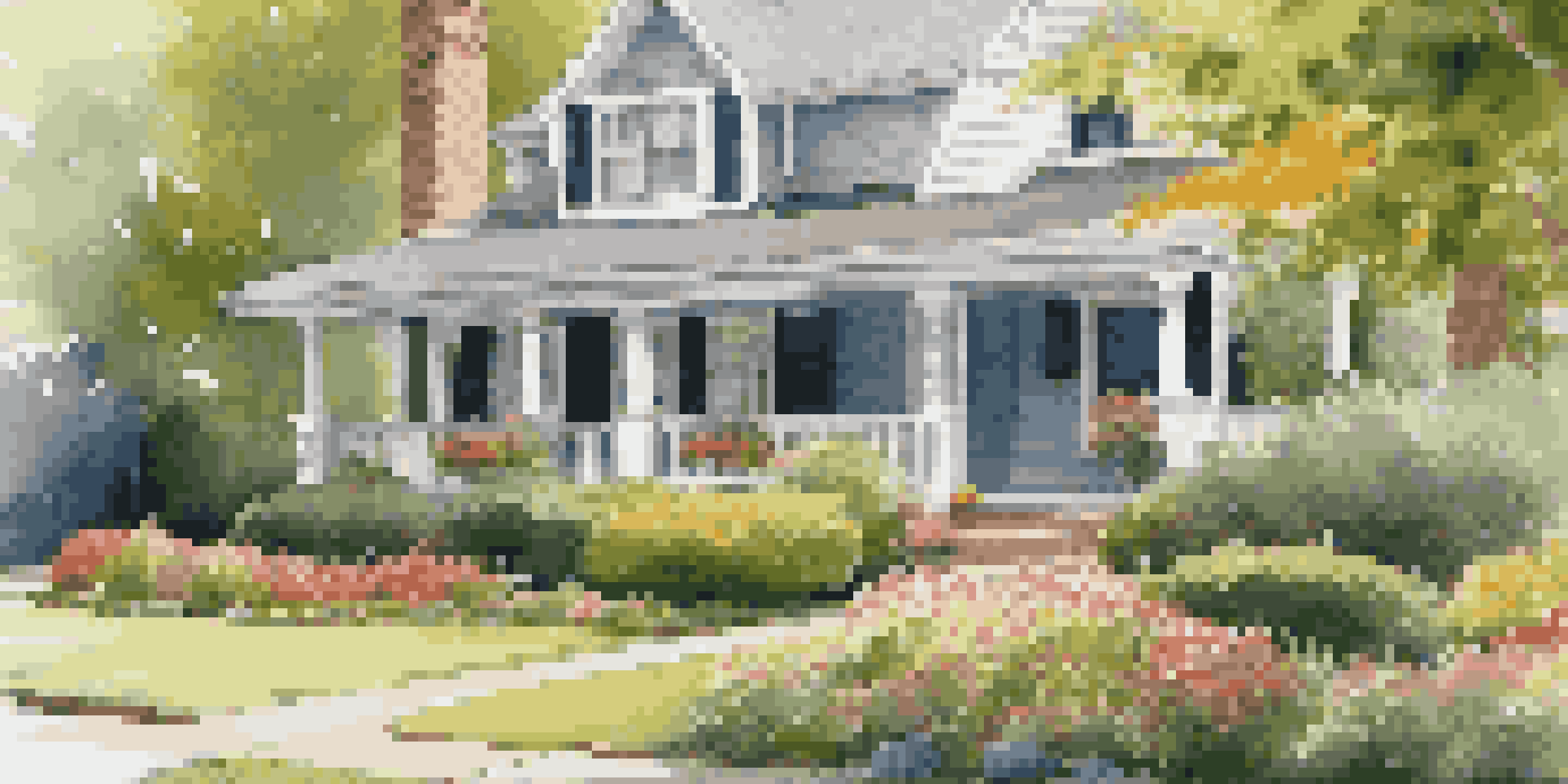 A suburban home with a manicured lawn, flower beds, and a pathway, illuminated by soft sunlight.