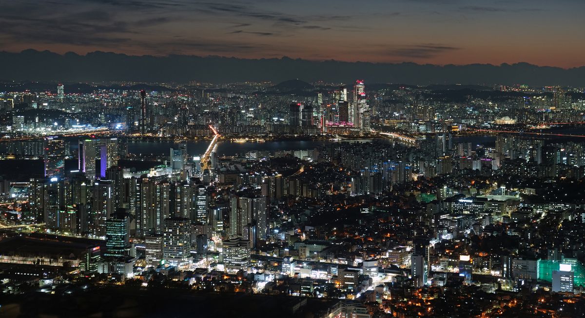 The night view of Seoul spread out below N Seoul Tower on Namsan, with the Han River and city lights.