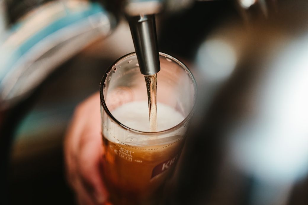 person filling clear glass with liquid — Credit: Photo by BENCE BOROS on Unsplash