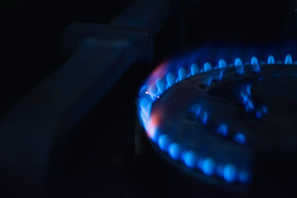a close up of a blue flame on a stove — Credit: Photo by Avinash Shet on Unsplash