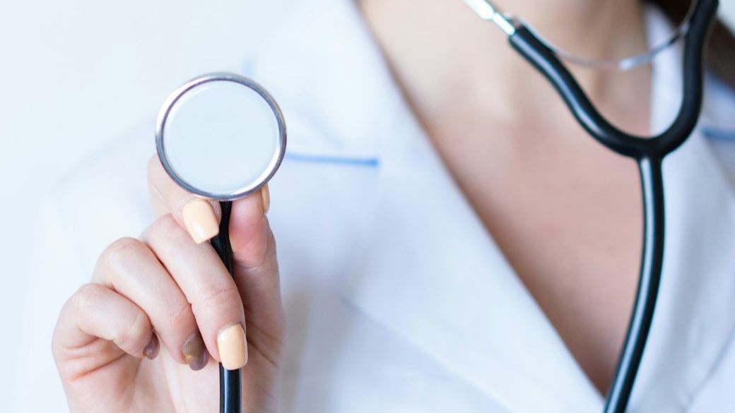 a woman in a white shirt holding a stethoscope — Credit: Photo by Alexandr Podvalny on Unsplash