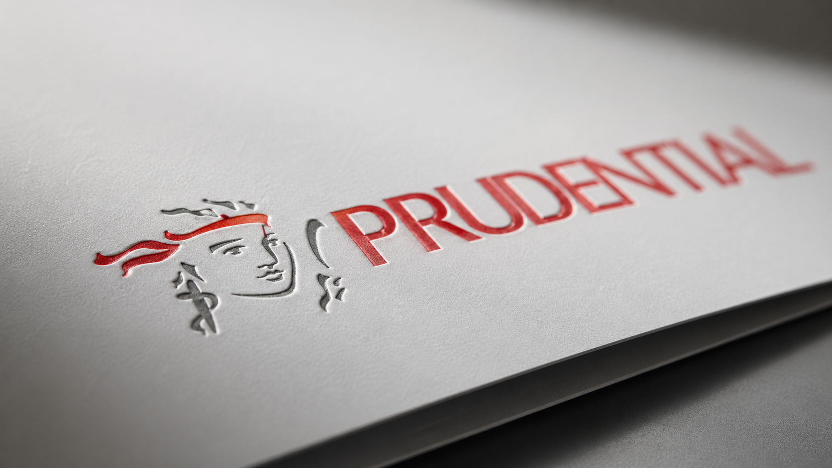 The image features the logo of Prudential, prominently displayed against a textured gray background. The logo includes a stylized figure of a person with a headband, conveying a sense of strength and assurance.