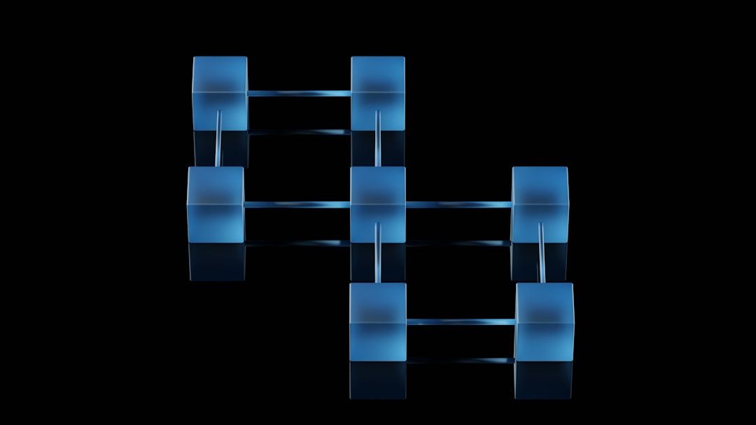The image features abstract geometric shapes in a grid-like formation, illuminated in blue against a black background. The visual elements evoke a sense of modernity and technology.