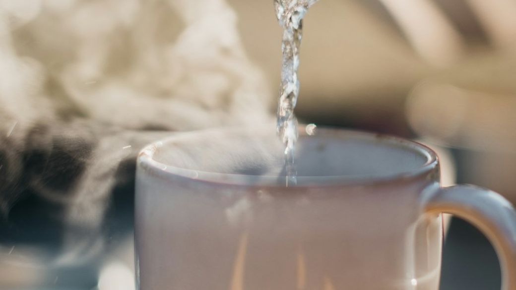 a glass pouring water into a cup — Credit: Photo by Redd Francisco on Unsplash