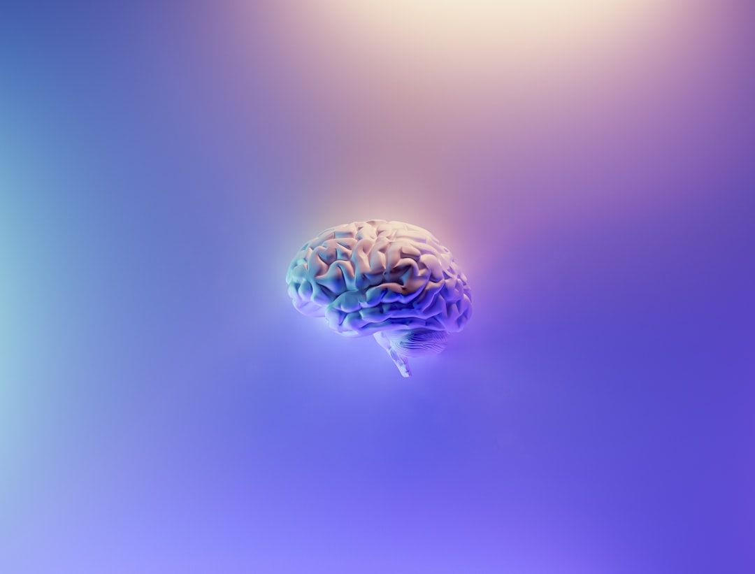 The image depicts a stylized human brain floating against a gradient background. The design emphasizes the brain's intricate structure and suggests themes related to intelligence and cognition.