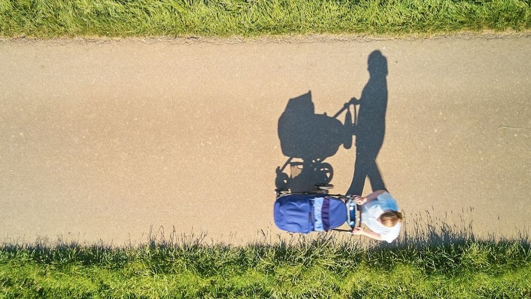 My wife while we were on one of our first walks with our firstb-born. — Credit: Photo by Johny Goerend on Unsplash