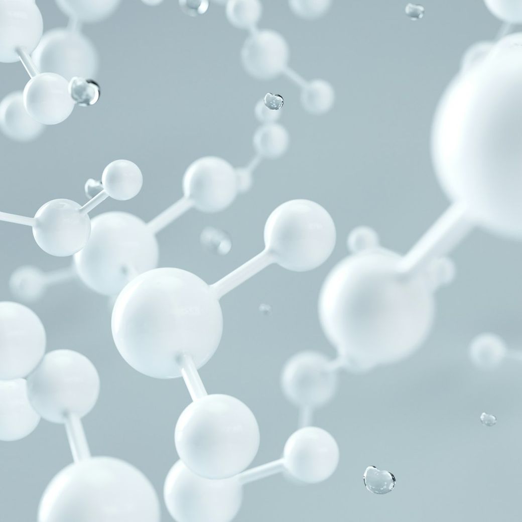 The image features a close-up view of molecular structures, showcasing interconnected spheres that represent atoms. The light background emphasizes the clarity and detail of the molecular connections. — Credit: Photo by D koi on Unsplash