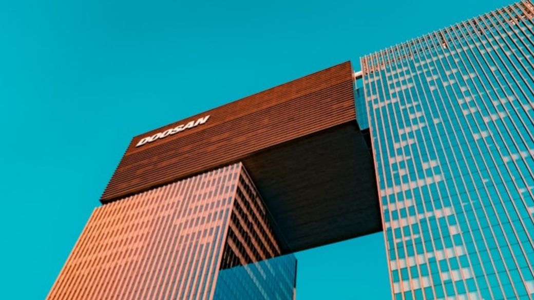blue glass walled high rise building — Credit: Photo by zero take on Unsplash
