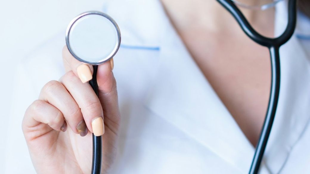 a woman in a white shirt holding a stethoscope — Credit: Photo by Alexandr Podvalny on Unsplash