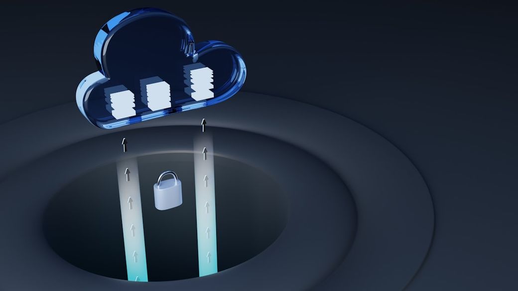 The image depicts a stylized cloud symbol above a dark background, with digital database icons representing data storage. Below the cloud, a padlock is shown, suggesting themes of data security and cloud computing. — Credit: Photo by Growtika on Unsplash
