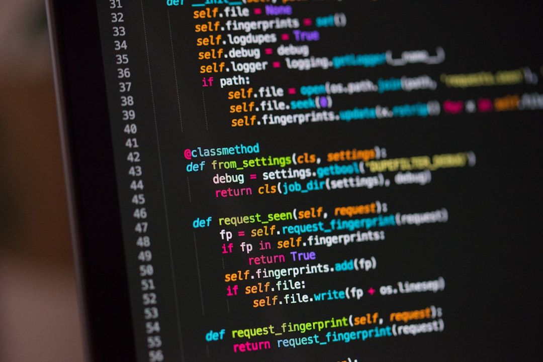 The image displays a close-up view of a computer screen showcasing lines of computer code. The code appears to be written in Python, indicating various functions and definitions.